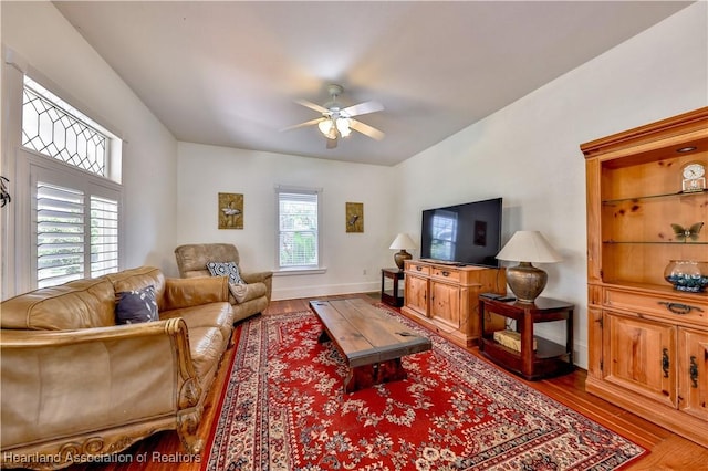 2220 Lakeview Dr, Sebring, FL 33870 - living area featuring baseboards, a ceiling fan, and wood finished floors