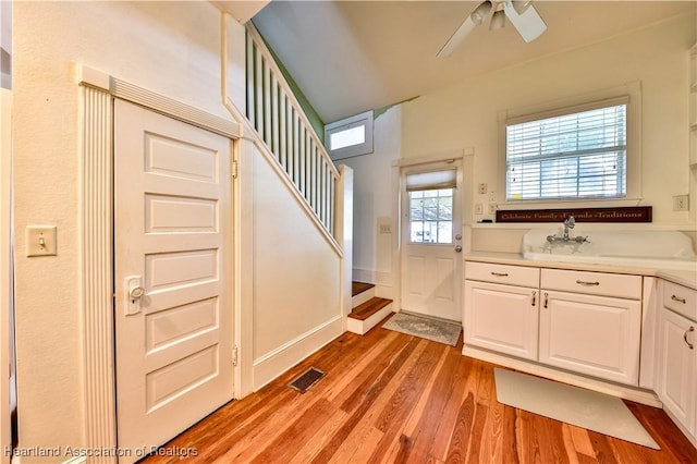2220 Lakeview Dr, Sebring, FL 33870 - interior space with light wood-type flooring, visible vents, stairway, and ceiling fan