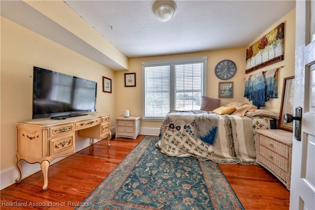2220 Lakeview Dr, Sebring, FL 33870 - bedroom featuring baseboards and wood finished floors