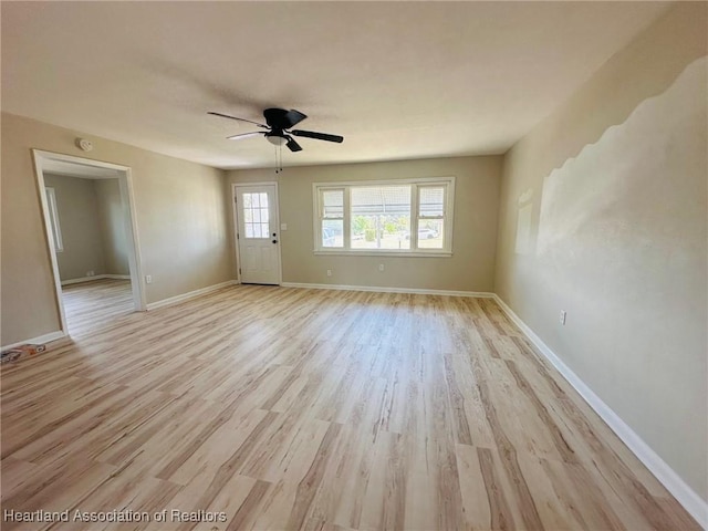 602 Wilhite St, Avon Park, FL 33825 - unfurnished room featuring light wood-style floors, a ceiling fan, and baseboards