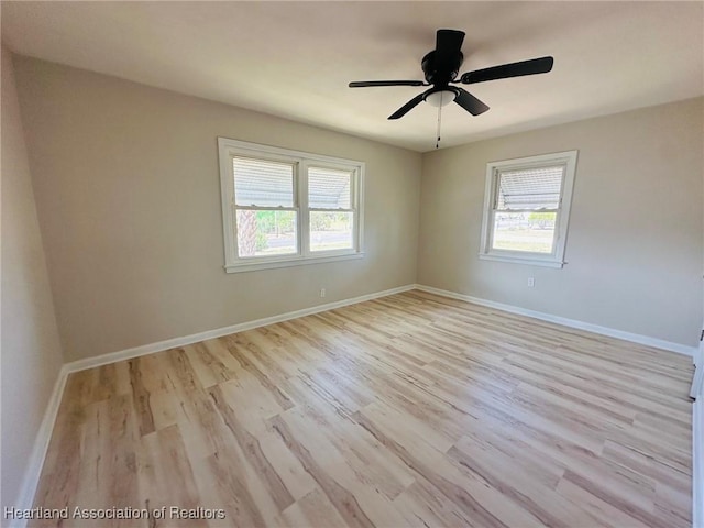 602 Wilhite St, Avon Park, FL 33825 - unfurnished room featuring a wealth of natural light, a ceiling fan, wood finished floors, and baseboards