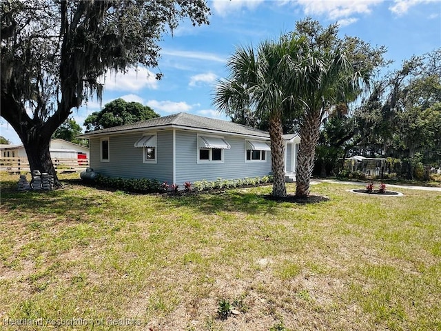 602 Wilhite St, Avon Park, FL 33825 - view of home's exterior with a lawn