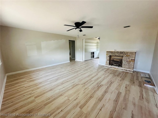 602 Wilhite St, Avon Park, FL 33825 - unfurnished living room featuring visible vents, wood finished floors, baseboards, and ceiling fan