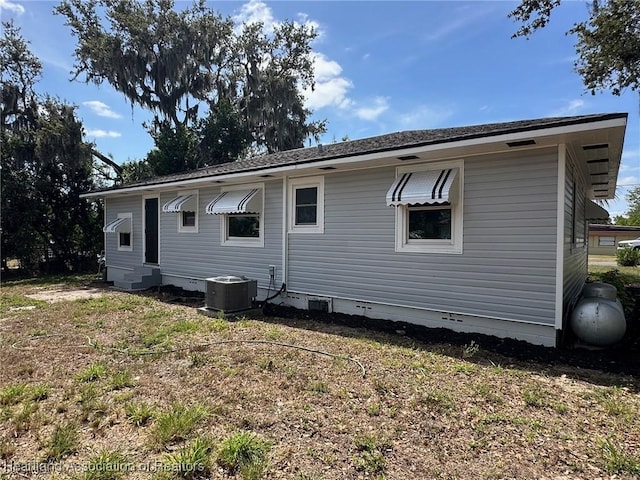 602 Wilhite St, Avon Park, FL 33825 - back of house with crawl space and central AC unit