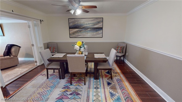 dining space with ceiling fan and crown molding