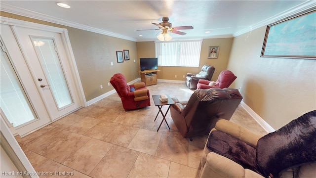 living room with ceiling fan and ornamental molding