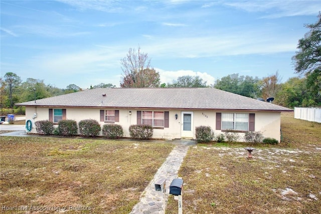 ranch-style home with a front yard