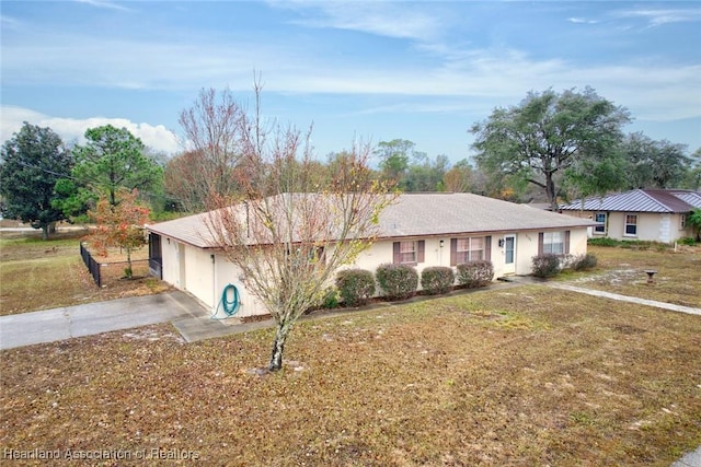 ranch-style house with a front lawn