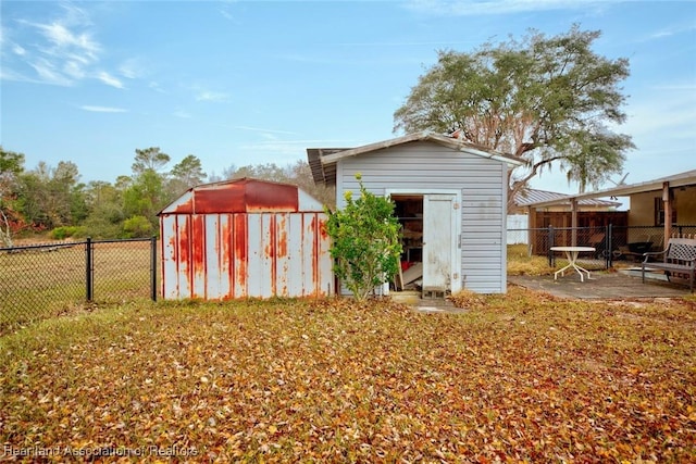 view of outbuilding with a yard