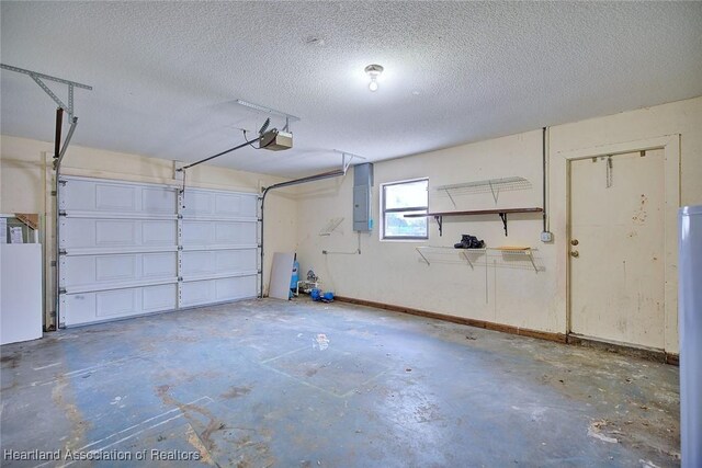 garage with a garage door opener and electric panel