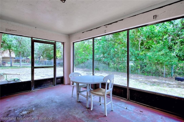 sunroom with outdoor dining area