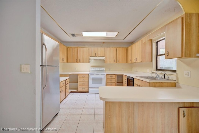 kitchen with electric range, light brown cabinetry, a sink, freestanding refrigerator, and under cabinet range hood