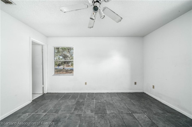 spare room with ceiling fan and a textured ceiling