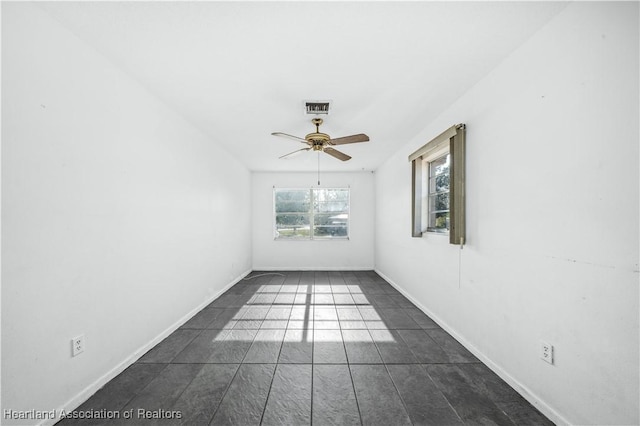 unfurnished room with ceiling fan