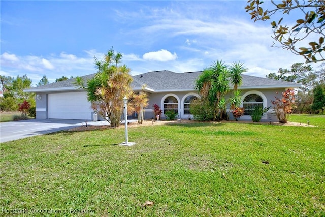 single story home with an attached garage, driveway, a front yard, and stucco siding