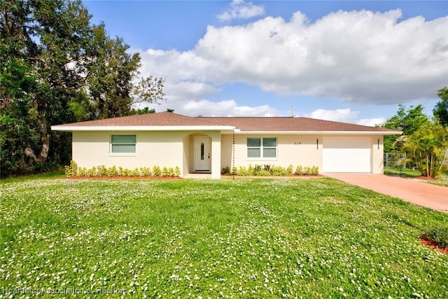 ranch-style home featuring a front yard and a garage