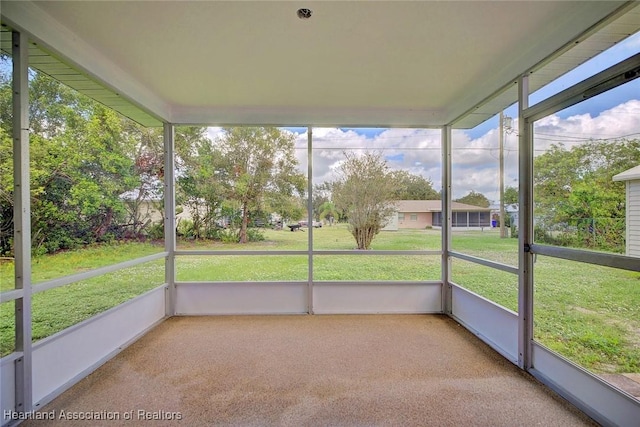 unfurnished sunroom with plenty of natural light