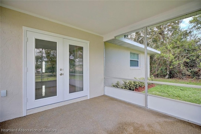 unfurnished sunroom featuring french doors