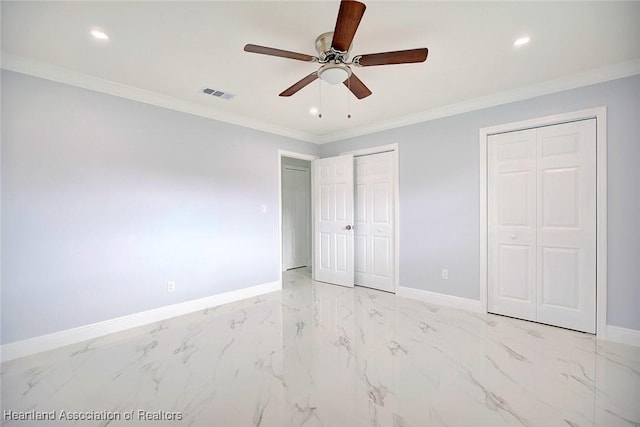 unfurnished bedroom with multiple closets, ceiling fan, and ornamental molding