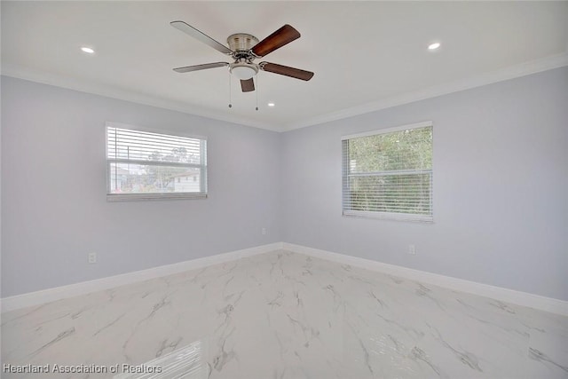 spare room with ceiling fan and ornamental molding