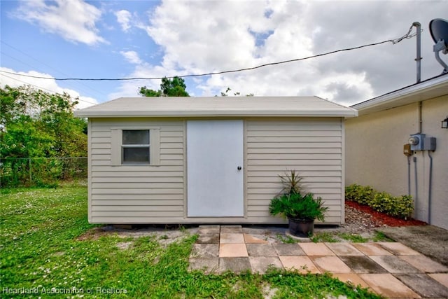 view of outdoor structure with a yard