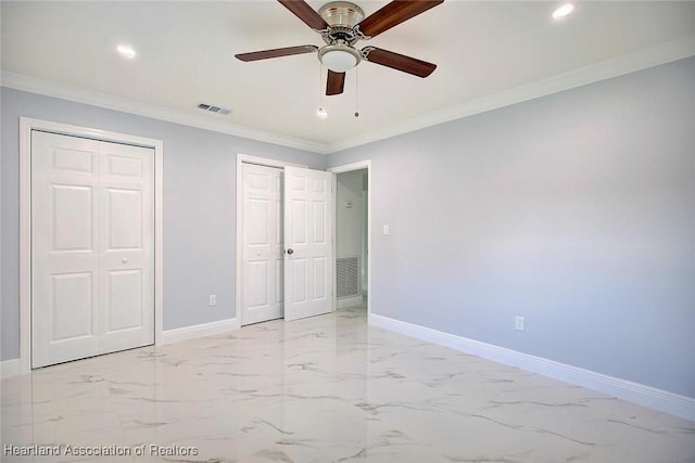 unfurnished bedroom featuring ceiling fan, ornamental molding, and two closets