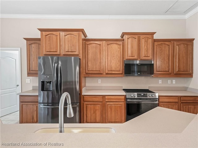 897 Entrance Rd, Avon Park, FL 33825 - kitchen with crown molding, visible vents, light countertops, and appliances with stainless steel finishes