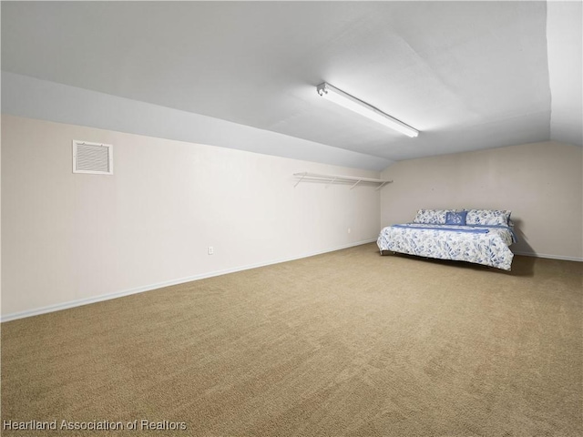 897 Entrance Rd, Avon Park, FL 33825 - interior space featuring baseboards, lofted ceiling, visible vents, and carpet floors