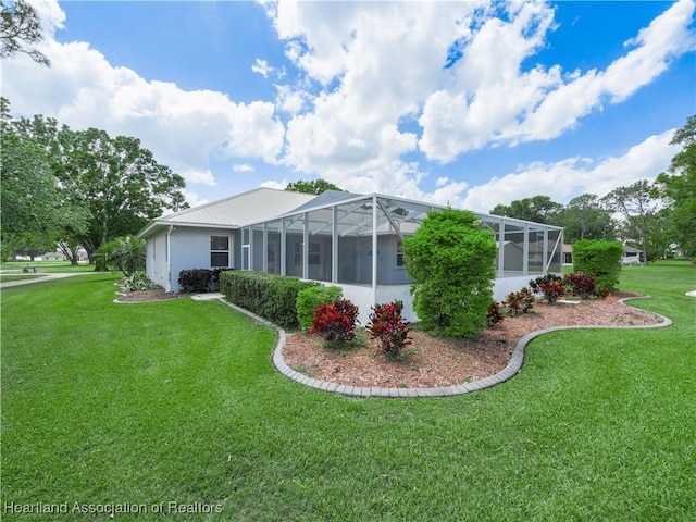 897 Entrance Rd, Avon Park, FL 33825 - exterior space featuring a lanai, stucco siding, and a lawn
