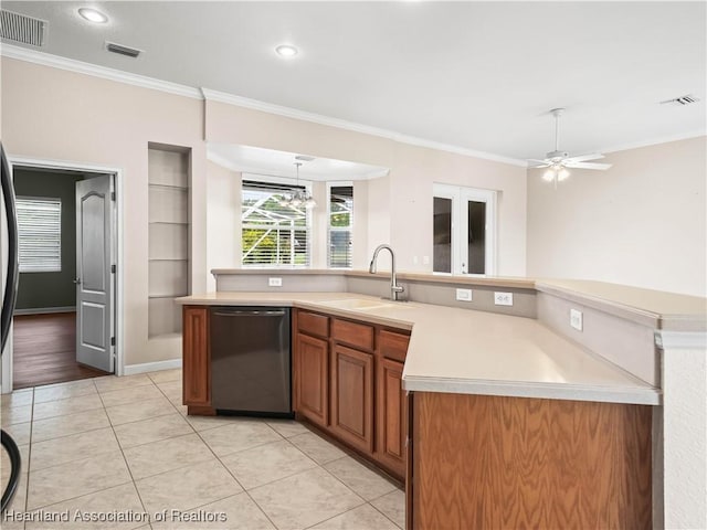 897 Entrance Rd, Avon Park, FL 33825 - kitchen with stainless steel dishwasher, light countertops, and visible vents