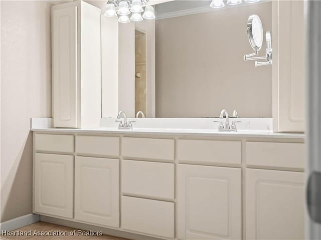897 Entrance Rd, Avon Park, FL 33825 - full bath with a chandelier, double vanity, a sink, and ornamental molding