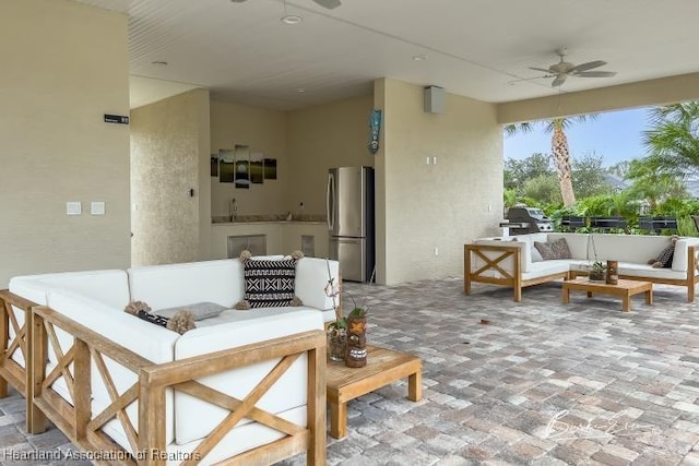 view of patio featuring ceiling fan and an outdoor hangout area