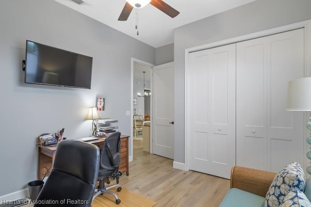 home office with ceiling fan and light wood-type flooring