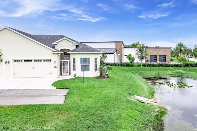 view of front of home with a garage and a front yard