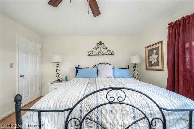 bedroom with ceiling fan and light hardwood / wood-style floors