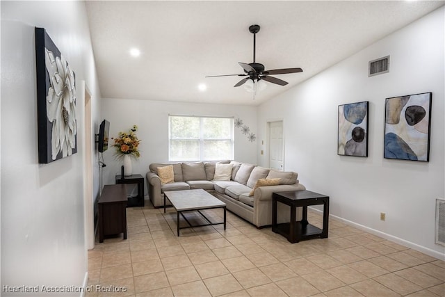 living room with ceiling fan, light tile patterned floors, and vaulted ceiling