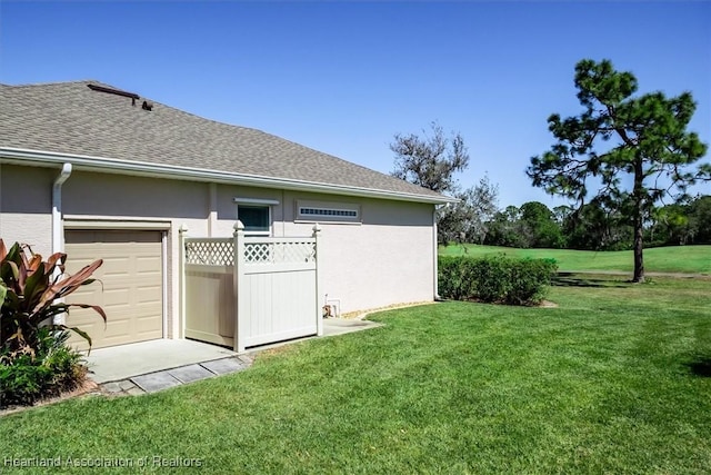 view of yard featuring an attached garage