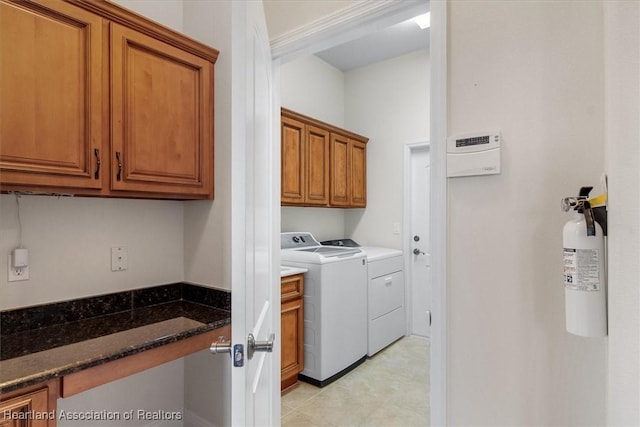 laundry room with cabinet space and separate washer and dryer