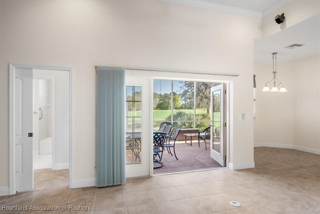 doorway to outside with visible vents, crown molding, baseboards, an inviting chandelier, and light tile patterned floors
