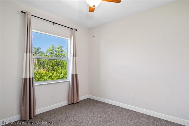 unfurnished room with baseboards, carpet floors, and a ceiling fan