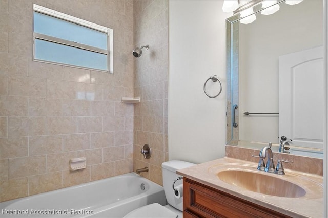 bathroom featuring shower / washtub combination, toilet, and vanity