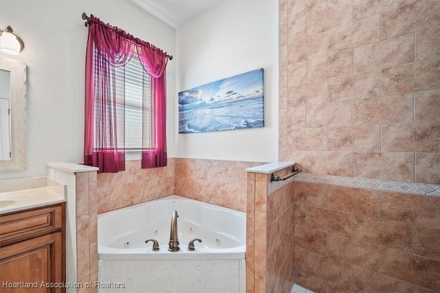 bathroom featuring a tub with jets, vanity, and a walk in shower