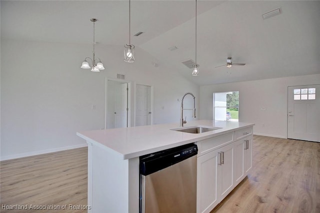 kitchen featuring dishwasher, sink, an island with sink, decorative light fixtures, and white cabinets