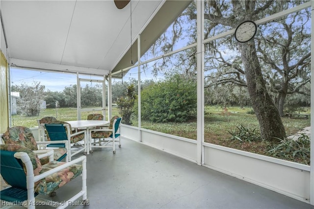 sunroom featuring lofted ceiling