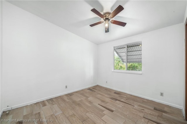 empty room with ceiling fan and light wood-type flooring