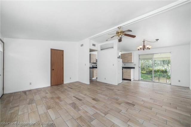 unfurnished living room featuring lofted ceiling, ceiling fan with notable chandelier, and light wood-type flooring