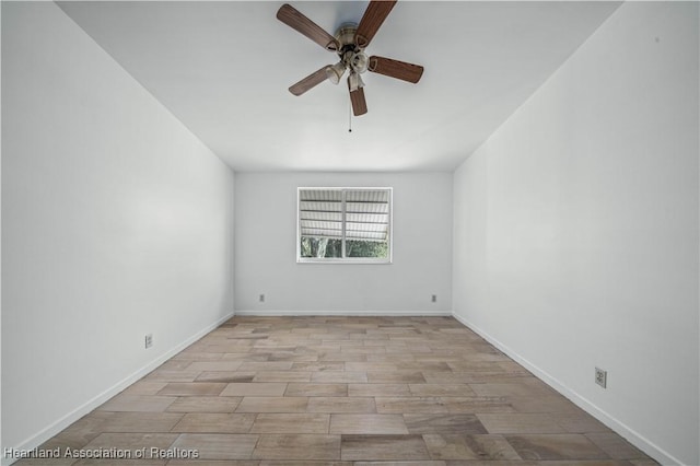 spare room featuring ceiling fan and light hardwood / wood-style floors