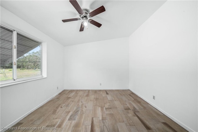 empty room with ceiling fan and light wood-type flooring