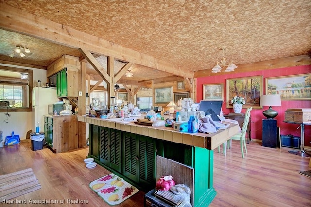 1320 Lakeview Dr, Sebring, FL 33870 - interior space featuring light wood-style floors and freestanding refrigerator