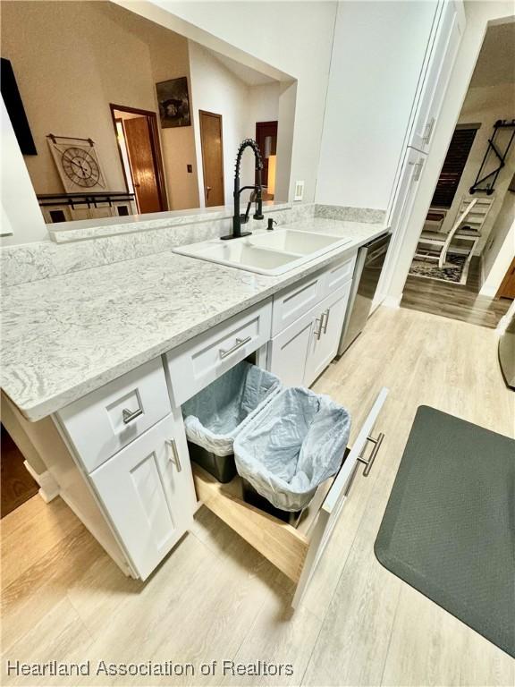 bathroom with sink and hardwood / wood-style floors